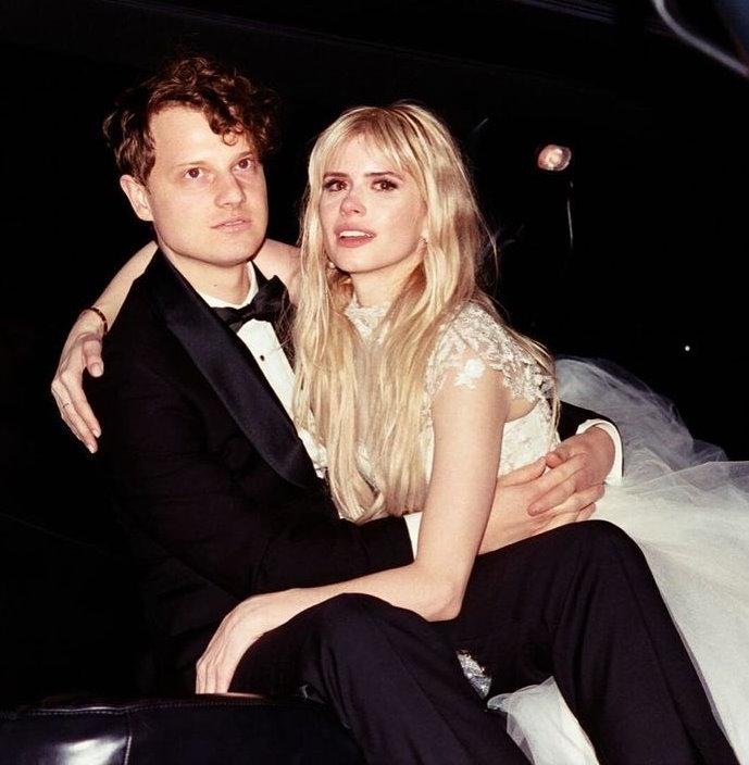 Carlson Young with her husband in wedding dress